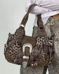 Leopard print and brown leather handbag with silver accents