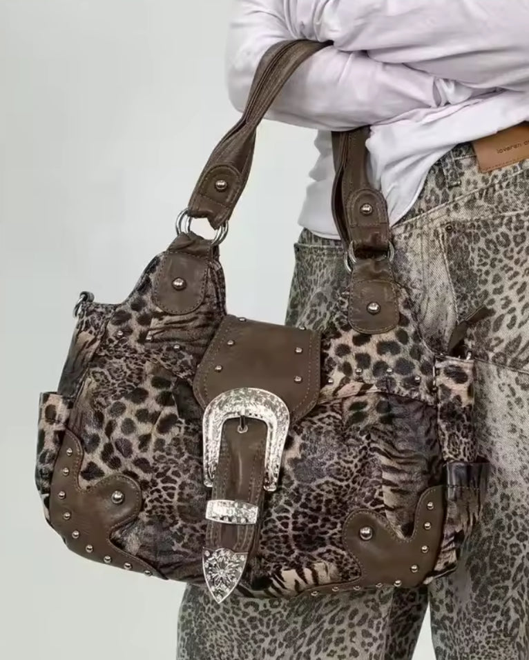 Leopard print and brown leather handbag with silver accents