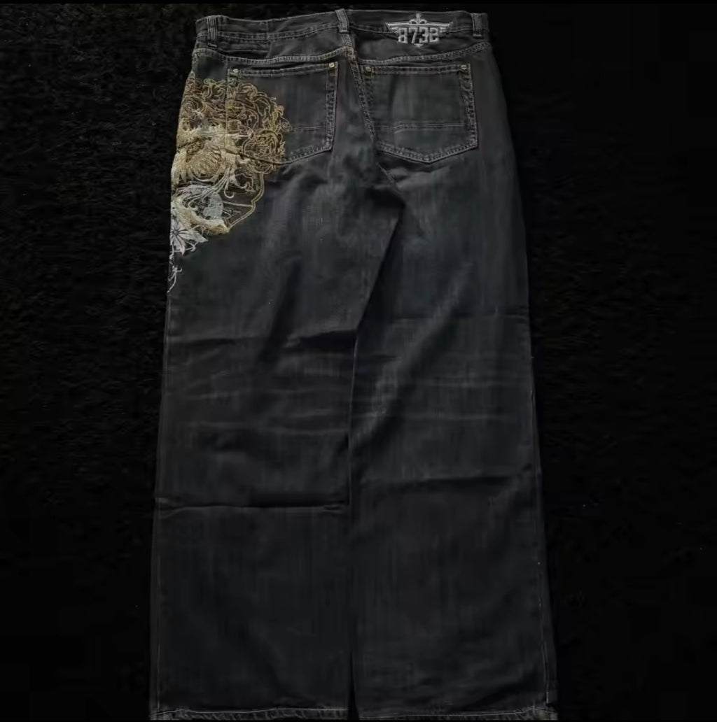 Black denim jeans with embroidered design