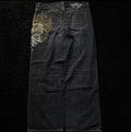 Black denim jeans with embroidered design