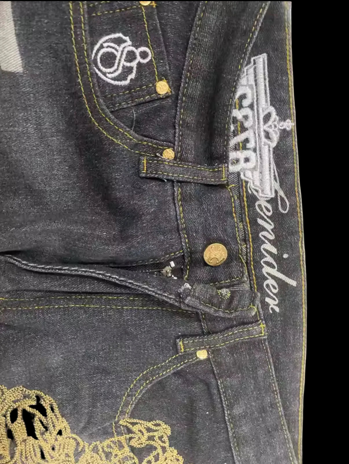 Black denim jeans with embroidered design
