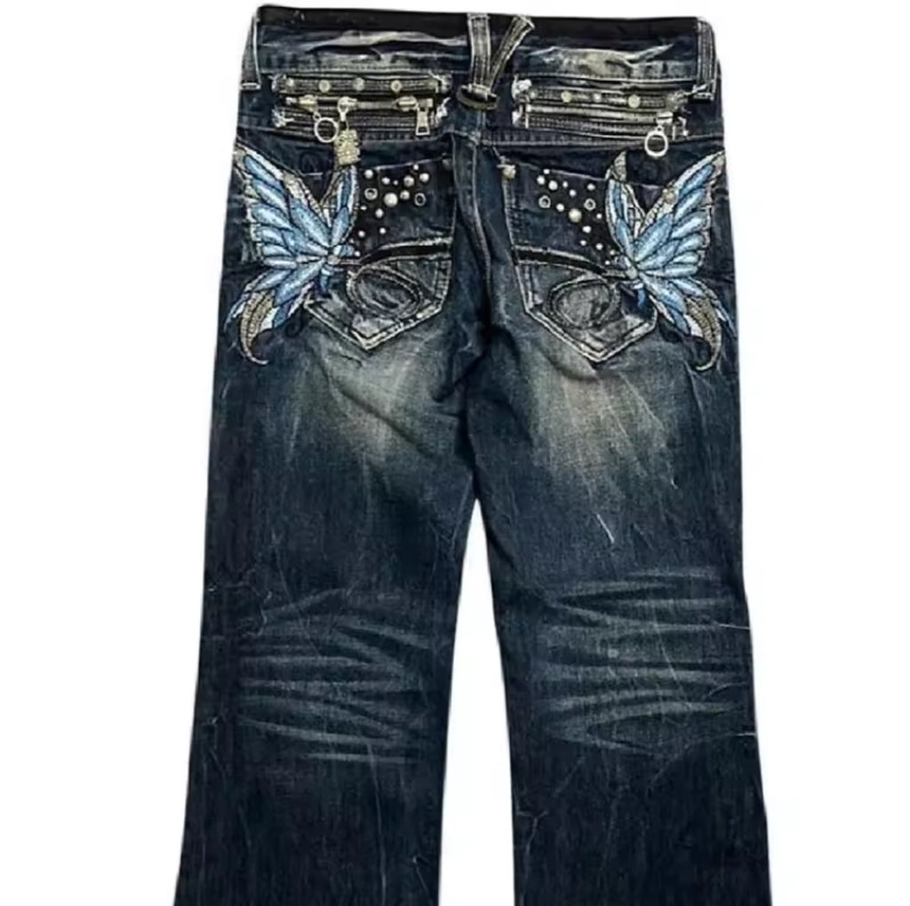 Blue butterfly embellished jeans with silver hardware