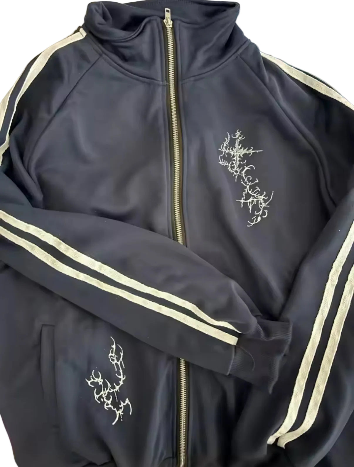Navy blue zip up jacket with white stripes